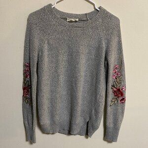 Light gray sweater with floral embroidery on sleeves